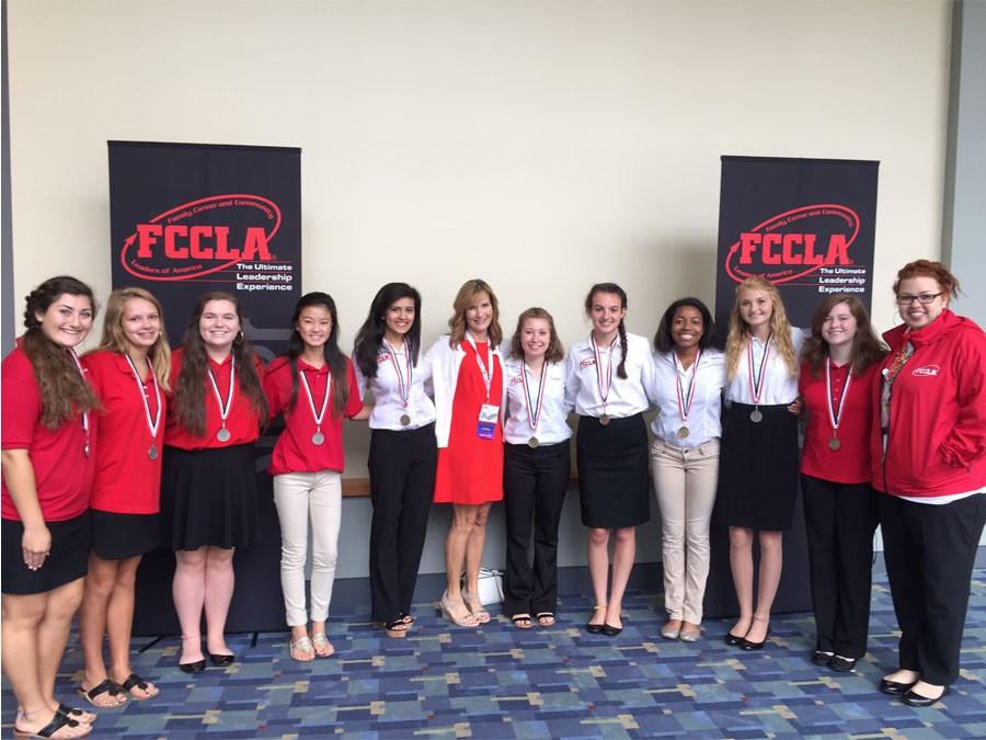 The+members+of+FCCLA+pose+for+a+photo+together+after+receiving+their+medals.