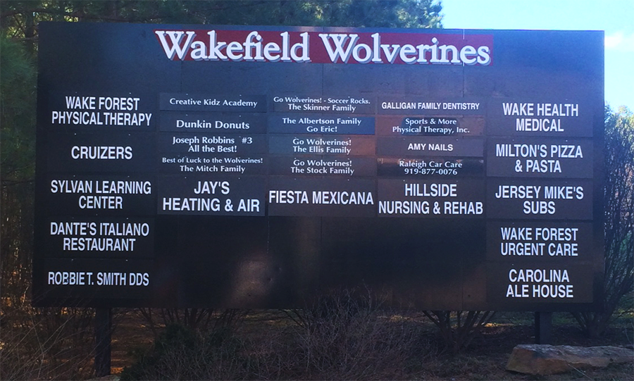 A list of school sponsors is located outside of the Wakefield football stadium.