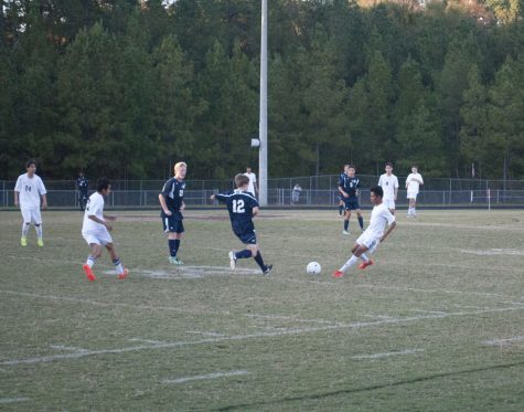 Wakefield soccer player dives in for the ball.