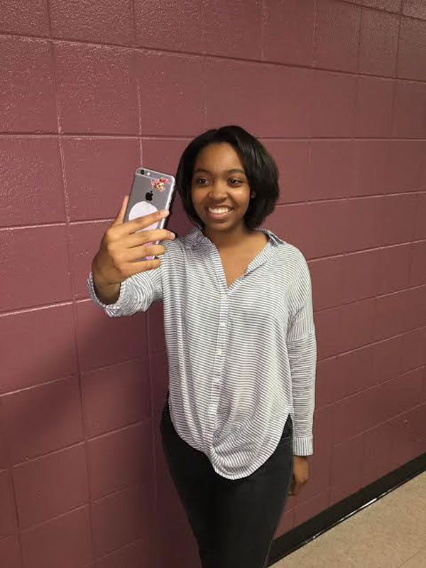 India Card shows off her free spirit while taking  a selfie to post on her finsta.