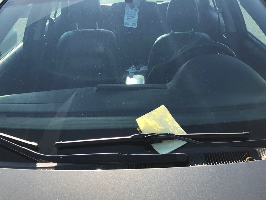 Students returning to poorly parked cars in the student parking lot dread the yellow ticket.