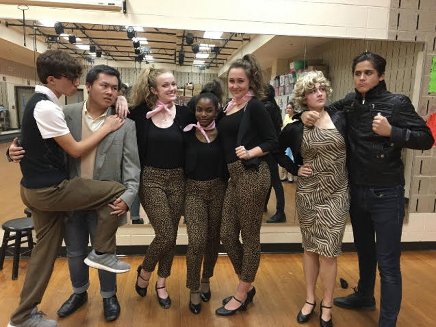 The cast of The Little Shop of Horrors pose for a picture during rehearsal. 