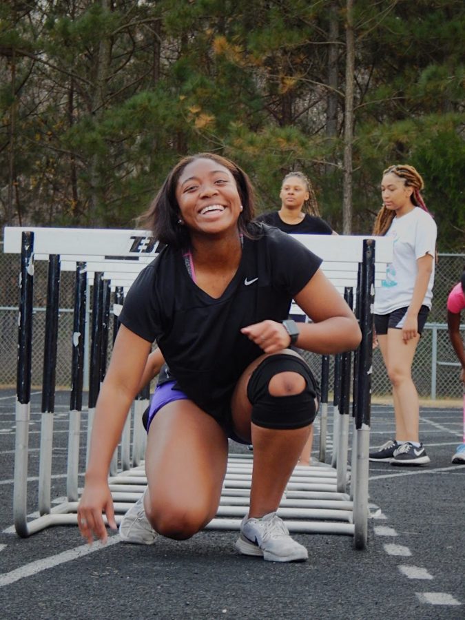 Jasmine Wilson- Johnson does a hurdle exercise during practice. 