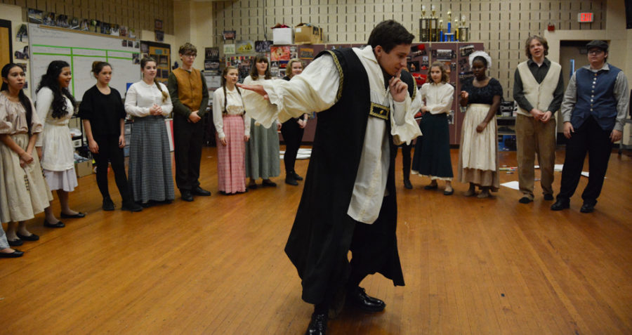 Senior, Nate Richardson, who plays Beast, leads warmups before Beauty and The Beast Performance.