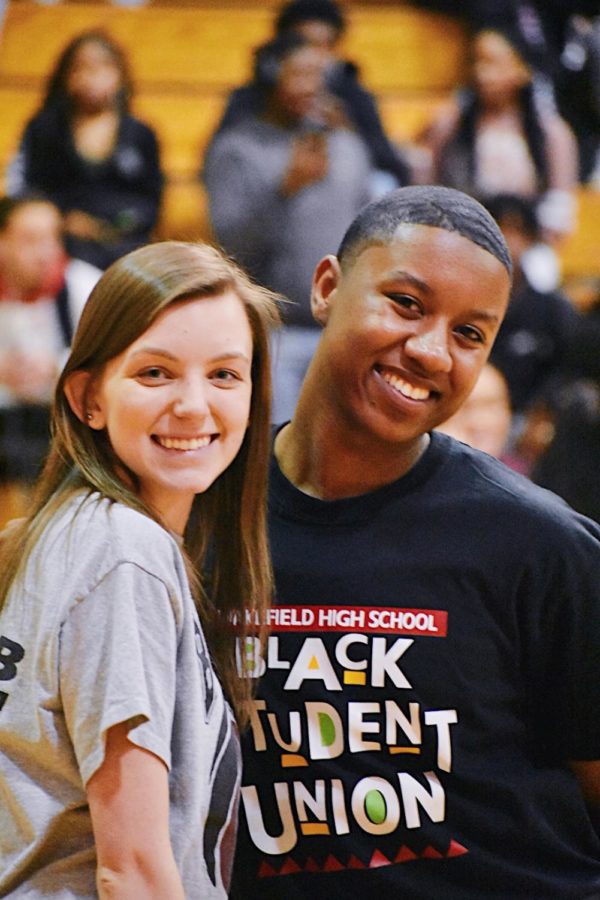 Kaitlyn Peterson and Senior Vice President Anthony Howard pose for a picture together before doing the pep rally M.C.