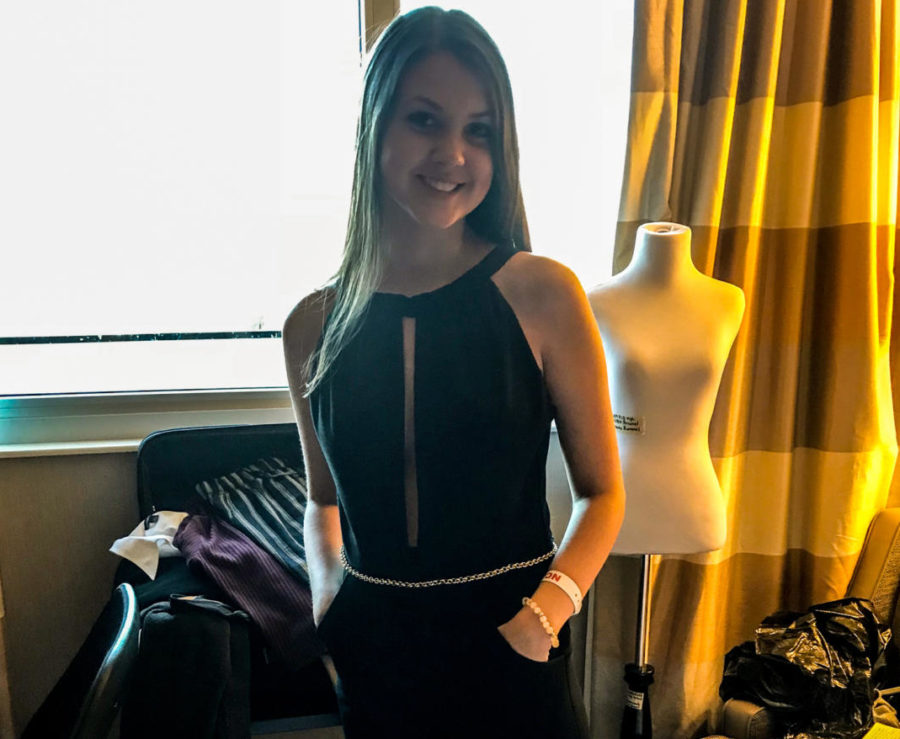 Stephanie Rummels shows off her jumpsuit creation.