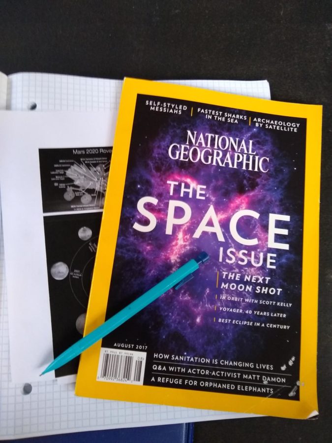 Stacked reading materials share information all about recent space exploration. 