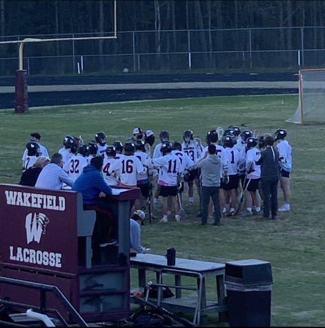 The Wakefield men’s lacrosse team huddles up to discuss their next move.