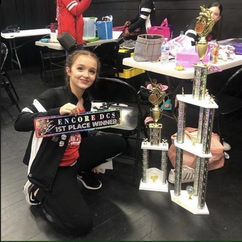 Sofia Colvin, a freshman at Wakefield High, displays her trophies from dance competitions.  