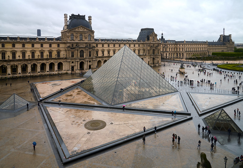 Tourists mill about as they wait for The Louvre to open, captured by Pedro Szekely.