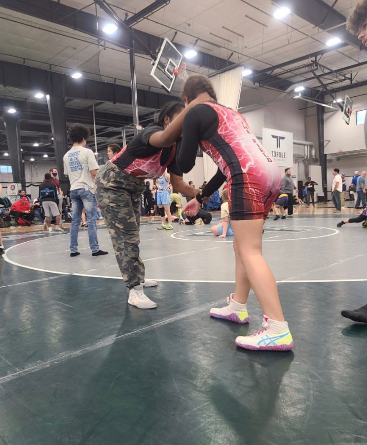 Wakefield womens wrestlers Rohama Gebremichael and Olivia Sadowy warm up before a match.