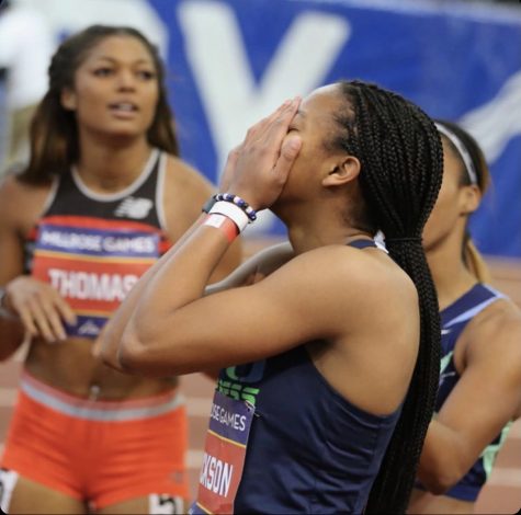 Shawnti Jackson covers her face in shock as she breaks her first national record. 