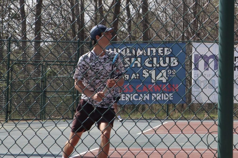 Wakefield Mens Tennis player Colin Regan warms up for a match against Wake Forest.