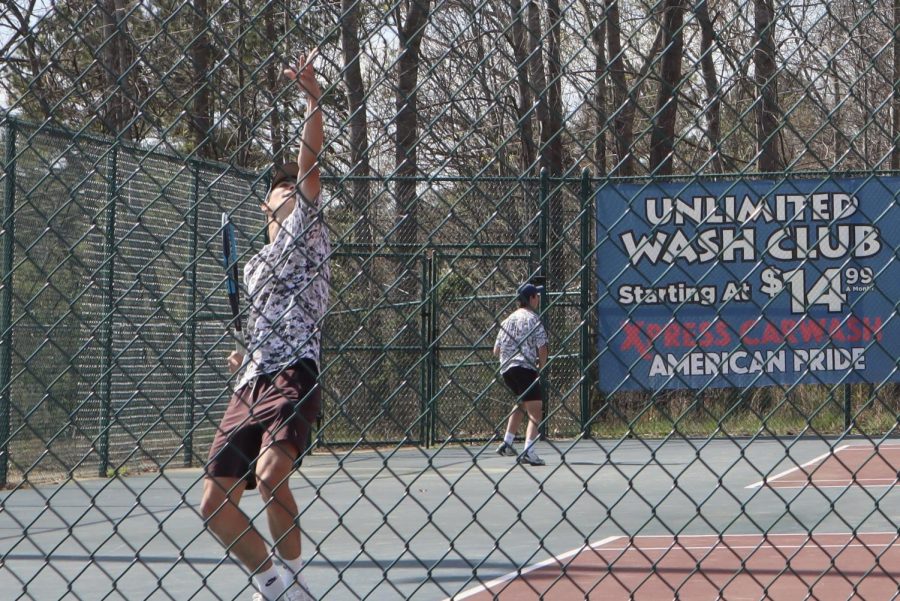 Wakefield Mens tennis player prepares Colin Regan prepares to swing on the Wake Forest High School tennis court.