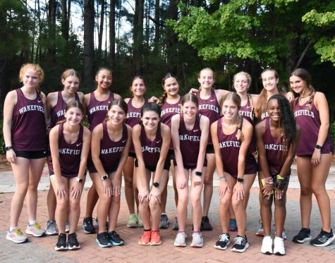 Womens cross country poses for a photo before their match against Rolesville and Wake Forest. They recently went to the Hough Invitational at Davidson College. 
