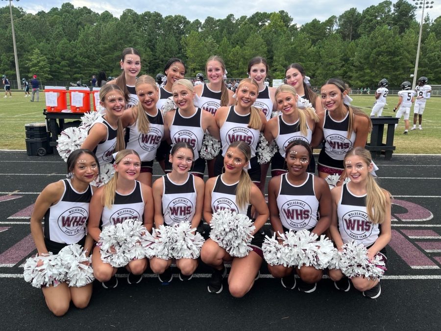 The Dance Team posed for a photo before the varsity football game against Leesville Road high school. They were on the sidelines the whole game cheering on the team as they played.  