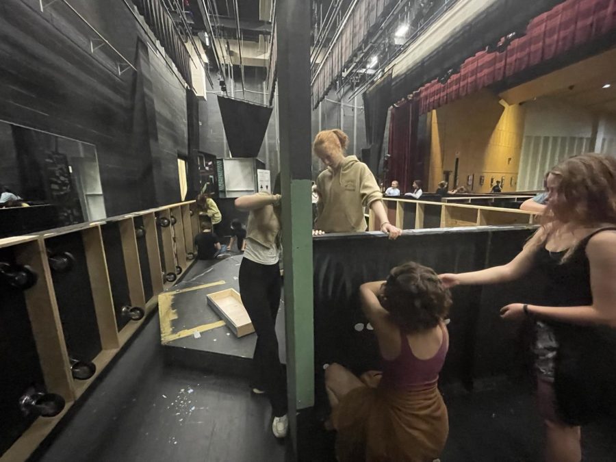 Members of Wakefield Theatre Company collaborate on the set of Haunted House.  This years theme is a haunted circus called Cirque du Slay.