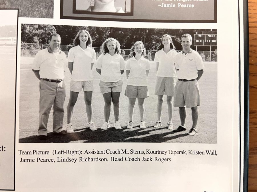The 2002 womens golf team at Wakefield High School. To the right stands head coach Jack Rogers, a friend of Reitz.