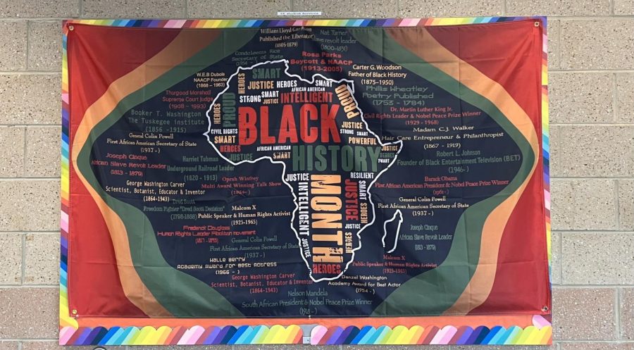 The+bulletin+board+outside+of+Wakefield+High+Schools+Student+Services+repping+a+Black+History+Month+tapestry+to+show+Black+pride.+