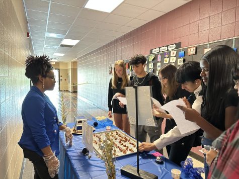 Students vote on a students meat and potato kabobs. Presentation, taste, and effort all are factors contributing to a students vote.