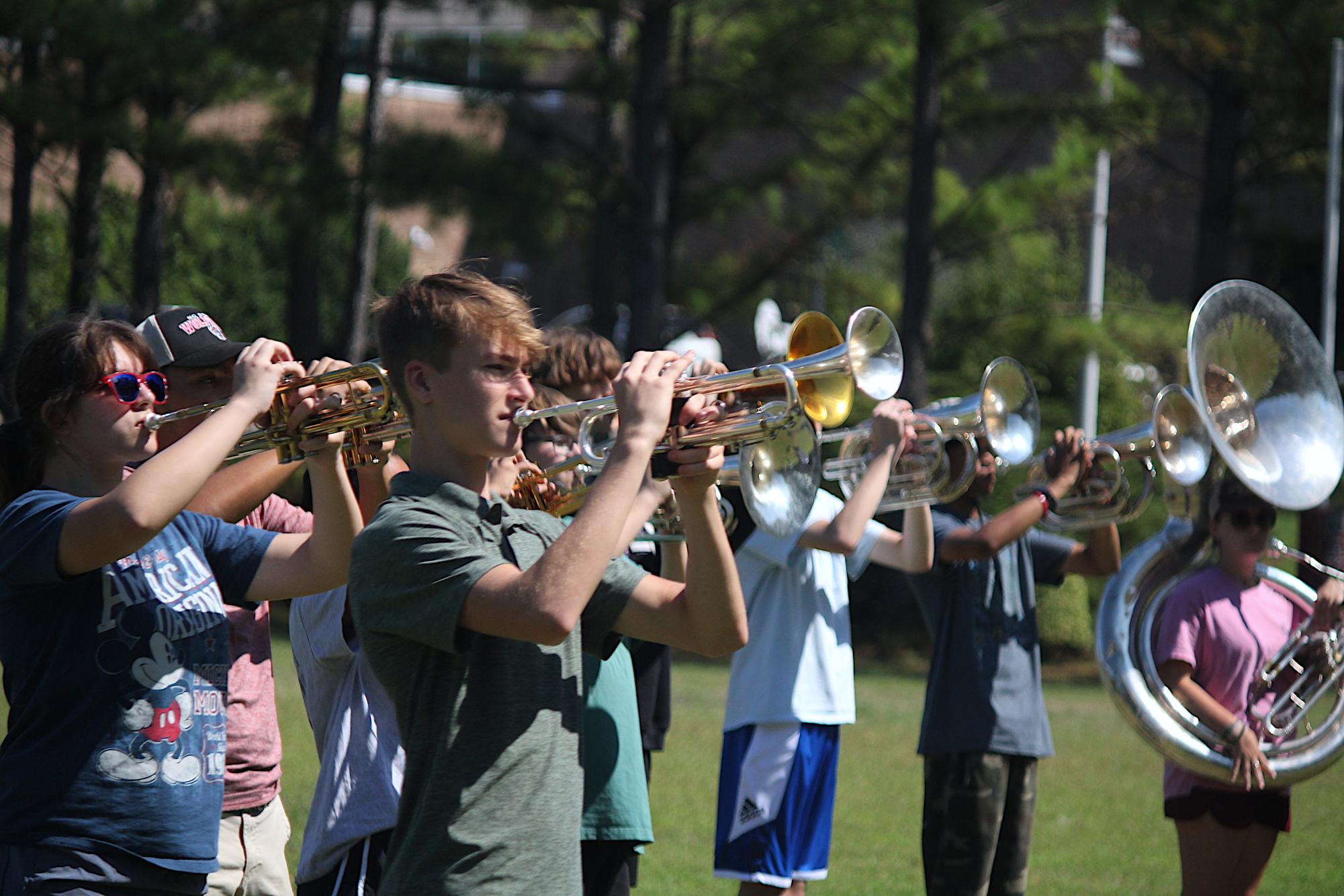 The Wakefield band practices outside in preparation for their Homecoming performance. The brass section gets ready for both playing and marching.