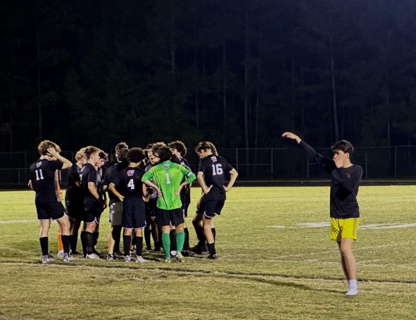 The boys huddle up at the end of the first half as they look to wrap things up against Knightdale on Oct. 2. They went on to win the game, 10-1, with multiple players registering 2 goals each.