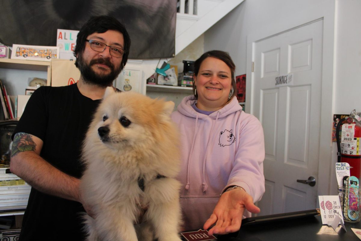 Jaime Radar and Amber Echevarria try to direct their pomeranian Munjo at the camera. Spending almost every day in their store, theyre happy to help everyone that walks in!