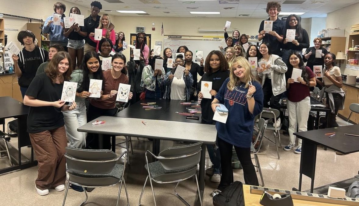 After a club meeting creating cards for a local hospital, the Cancer Awareness Society at Wakefield High School poses for a picture. The club was founded in 2023.