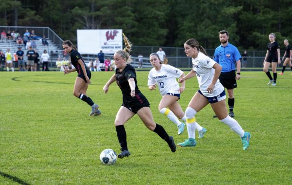 Madi Gross dribbles away from pressure to create opportunities for an attack. The chemistry among her fellow teammates helps the offense thrive. 