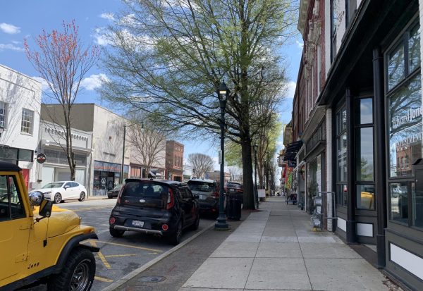 Cars line the sidewalk in downtown Greensboro. You can shop at countless stores in this beautiful city, have a relaxing day at the bookstore or enjoy one of the many coffee shops and restaurants. 