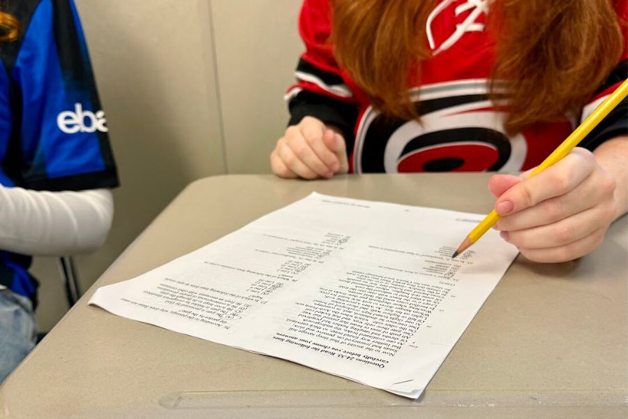 Senior Izzie Cochran reviews homework in her AP Literature class at Wakefield High School. Students have been navigating both coursework and ongoing HVAC issues throughout the building.