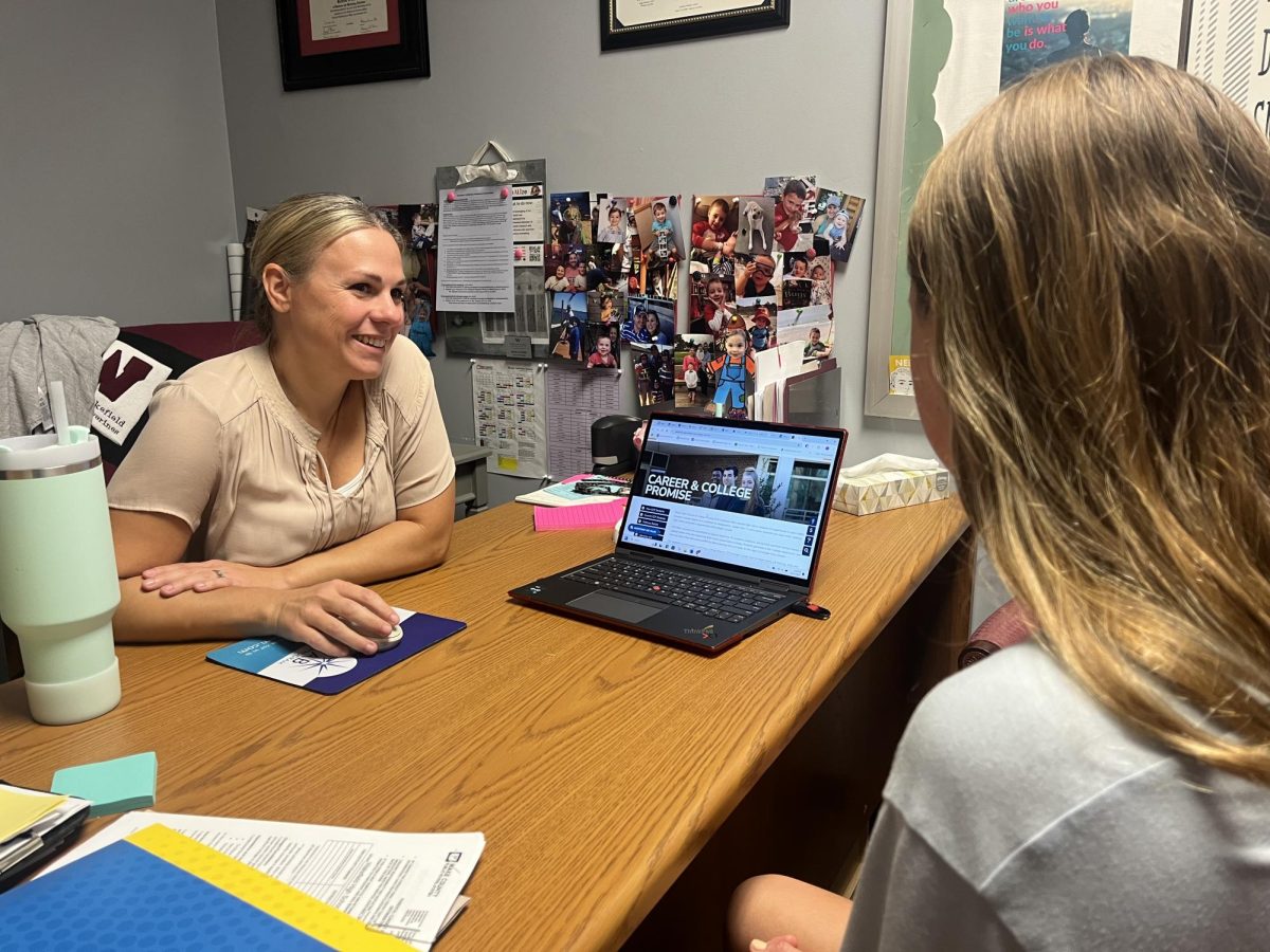 Wakefield High School's Career Development Coordinator, Sarah Joyner, helps a student plan for their future. She has surely made her mark on everyone who has entered her office.