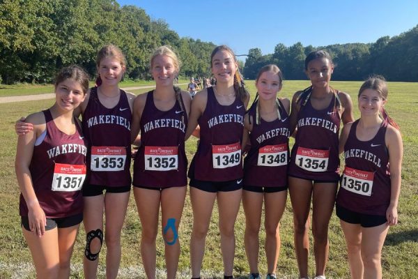 The Wakefield varsity cross country team prepares for a meet at Heritage High School. As their season progresses, their hard work and dedication continues to show. (Photo Courtesy of Gabby Lewis)