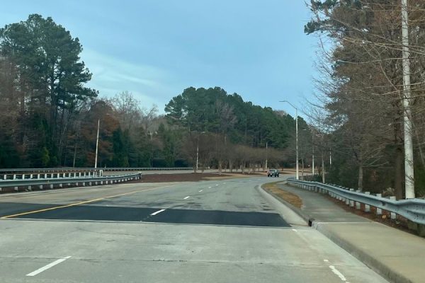 To repair the large bumps in the road when driving on and off the bridge on Falls of Neuse, the construction workers poured new concrete onto the problem areas. However, this project required closing the road for several weeks, which created a lot of frustration for students and staff travelling to and from school. 