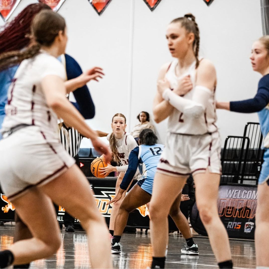 The women's basketball team plays an intense game during the Battle of the Bull. Schaffer can be seen getting ready to shoot the ball. Photo courtesy of Benedict. 