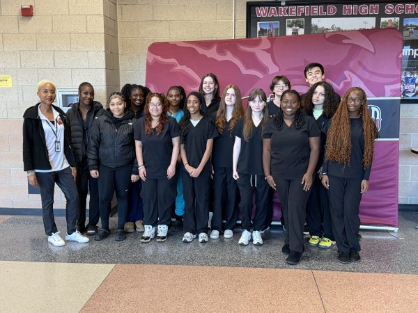 The Early Childhood Education together in their scrubs. They are prepared to go assist at their respective schools.
(Photo courtesy of Shavonne Lodenquai)