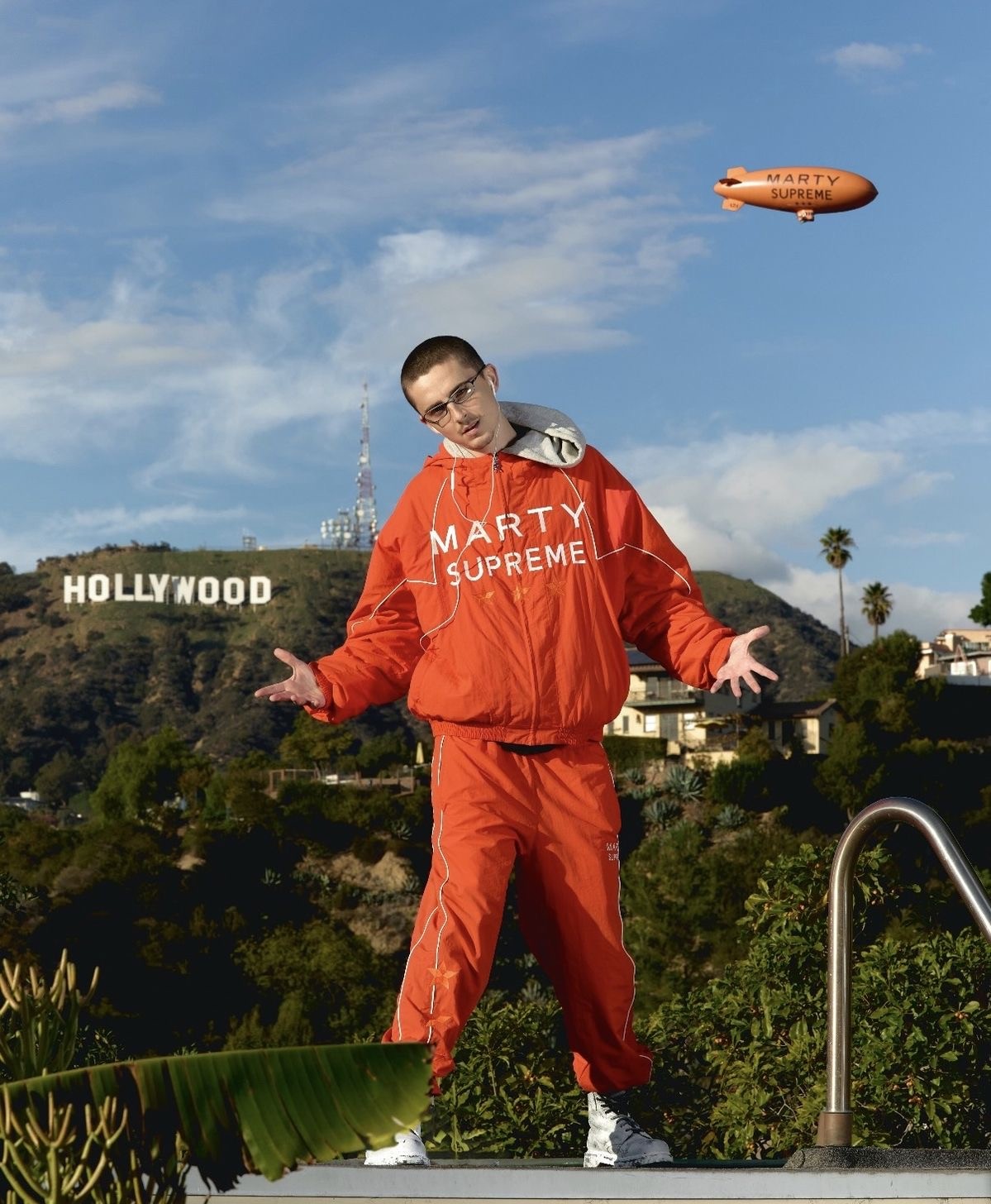 Timothée Chalamet wearing the popular "Marty Supreme" orange jacket in Hollywood to promote his new movie, (Photo Courtesy of Women's Wear Daily)